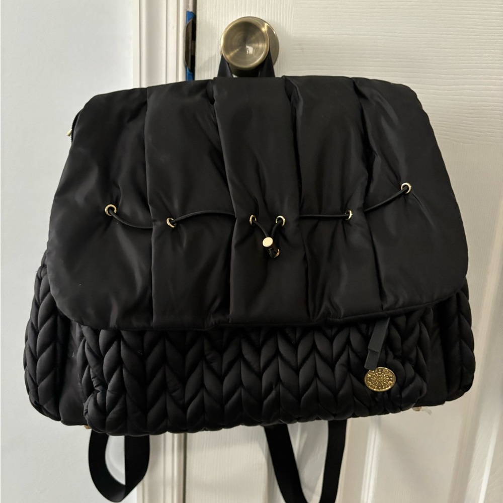 Black HAPP diaper bag with changing mat